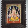 13x11 inch handmade Tanjore painting depicting Lord Ganesha, framed in brown teakwood and embellished with intricate 22K gold foils. Traditional Indian art for home decor or spiritual spaces.
