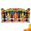 Handcrafted wooden Lakshmi Ganesha Saraswati wall panel made from solid country wood with detailed hand-painted carving, designed as Hindu wall decor for home temples, meditation rooms, living rooms, and spiritual interiors.