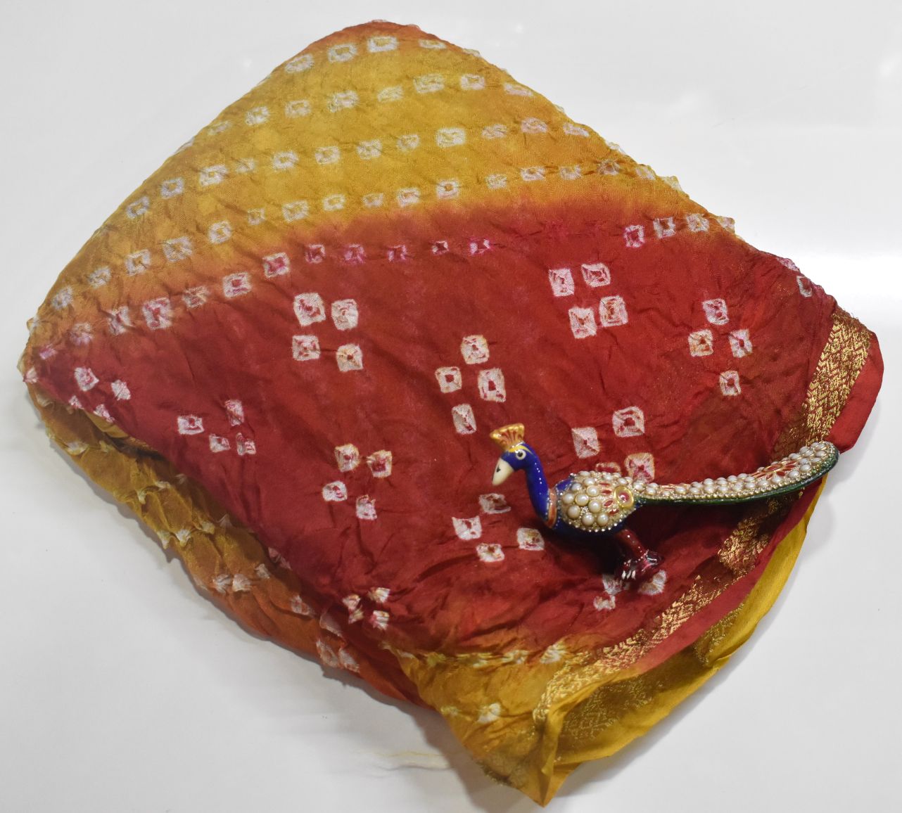 Jaipur Bandhani Saree in yellow body color with red border