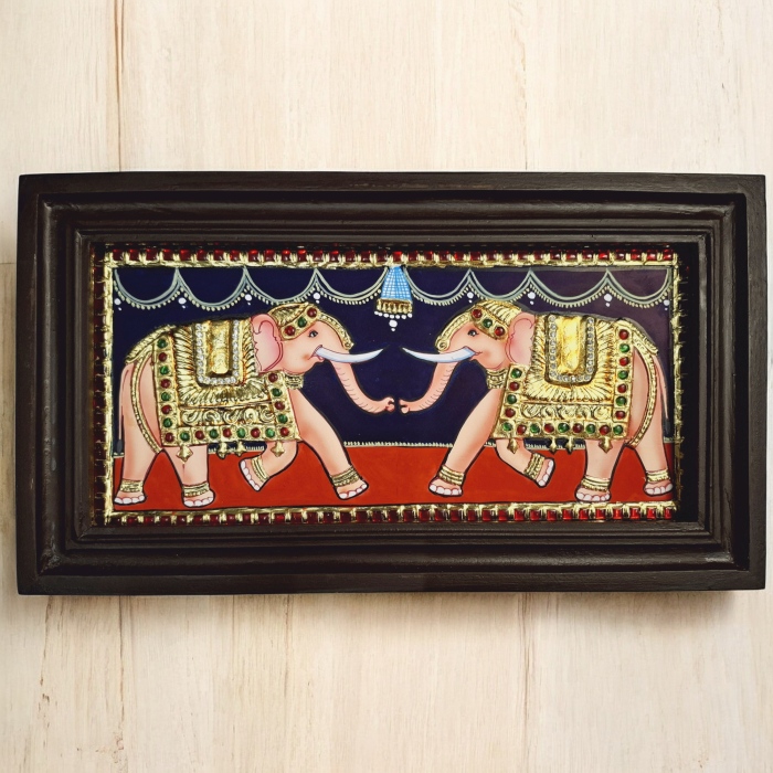 JLine Arts Elephant Tanjore Painting 33x18cm, hand-painted with 22K gold foil and crystal rhinestones, set in a teakwood frame.