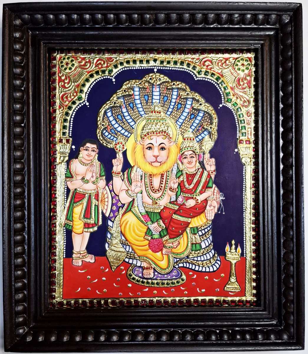 Handpainted Lakshmi Narasimha Tanjore Painting with 22K gold foil, Jaipur rhinestones and teakwood frame. Lord Narasimha with Goddess Lakshmi and Prahlada. 18x15 inches. Perfect for puja room or Diwali gift. Ships free from India.