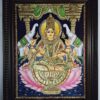 Gajalakshmi Tanjore Painting 27x21 inches – Hindu Goddess Lakshmi seated with elephants, framed artwork with 22K gold foil, traditional Indian décor.