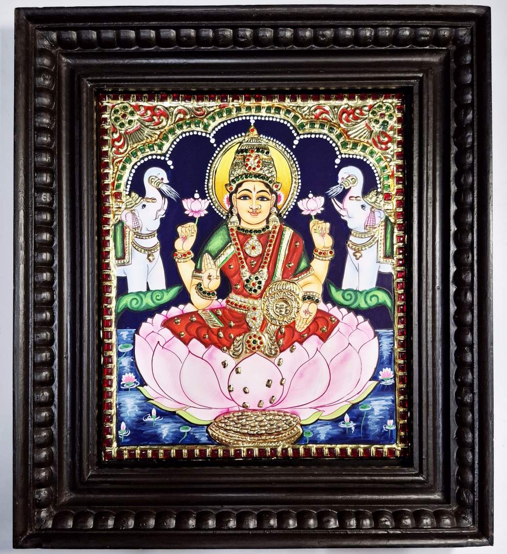 Lakshmi Tanjore painting with 22K gold foil in teakwood frame, 15x13 inches, handmade Indian art for pooja room or spiritual gift.