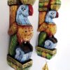 Set of 2 hand-carved wooden peacock bird wall brackets with brass bells. Vibrant multicolor — blue, green, gold, red. South Indian temple bird design, 12x4x2 inches each. Ready to hang. Perfect for puja room or housewarming gift. Ships free from India.