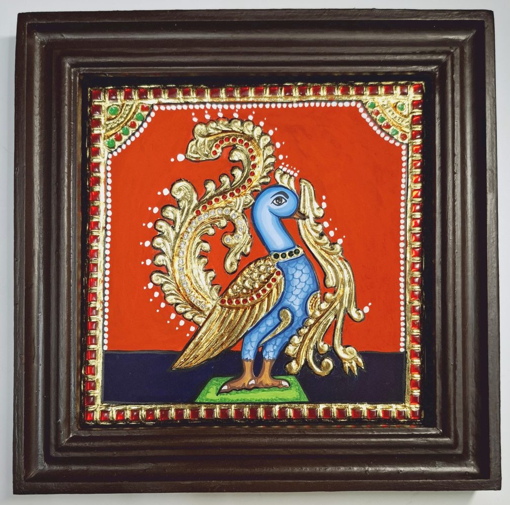 10x10 inch framed Peacock Tanjore Painting with 22K gold foil – handcrafted Indian artwork for gifting and home décor.
