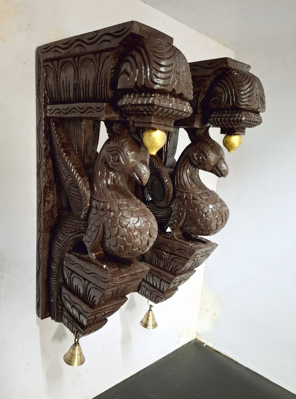 Beautifully hand-carved 18-inch wooden peacock wall brackets (2 pc set) from JLine Arts, with an antique/vintage finish and genuine brass bells. Perfect decorative corbels for entranceways or living room walls, ready to ship