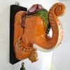 Elephant Head Corbel: A vintage-style wooden wall hanging featuring a decorative carved elephant head with a brass bell, perfect for Indian-themed home decor. Ready to ship.