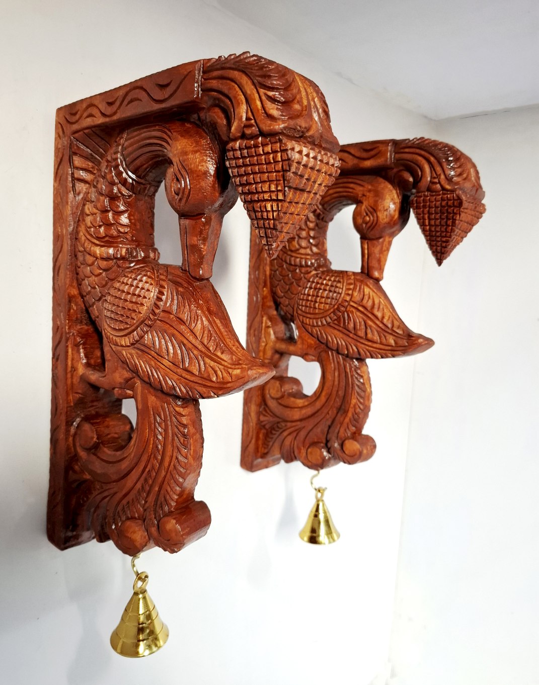 Hand-carved wooden peacock wall bracket pair 12 inch with antique brown finish and brass bells – South Indian temple style decor