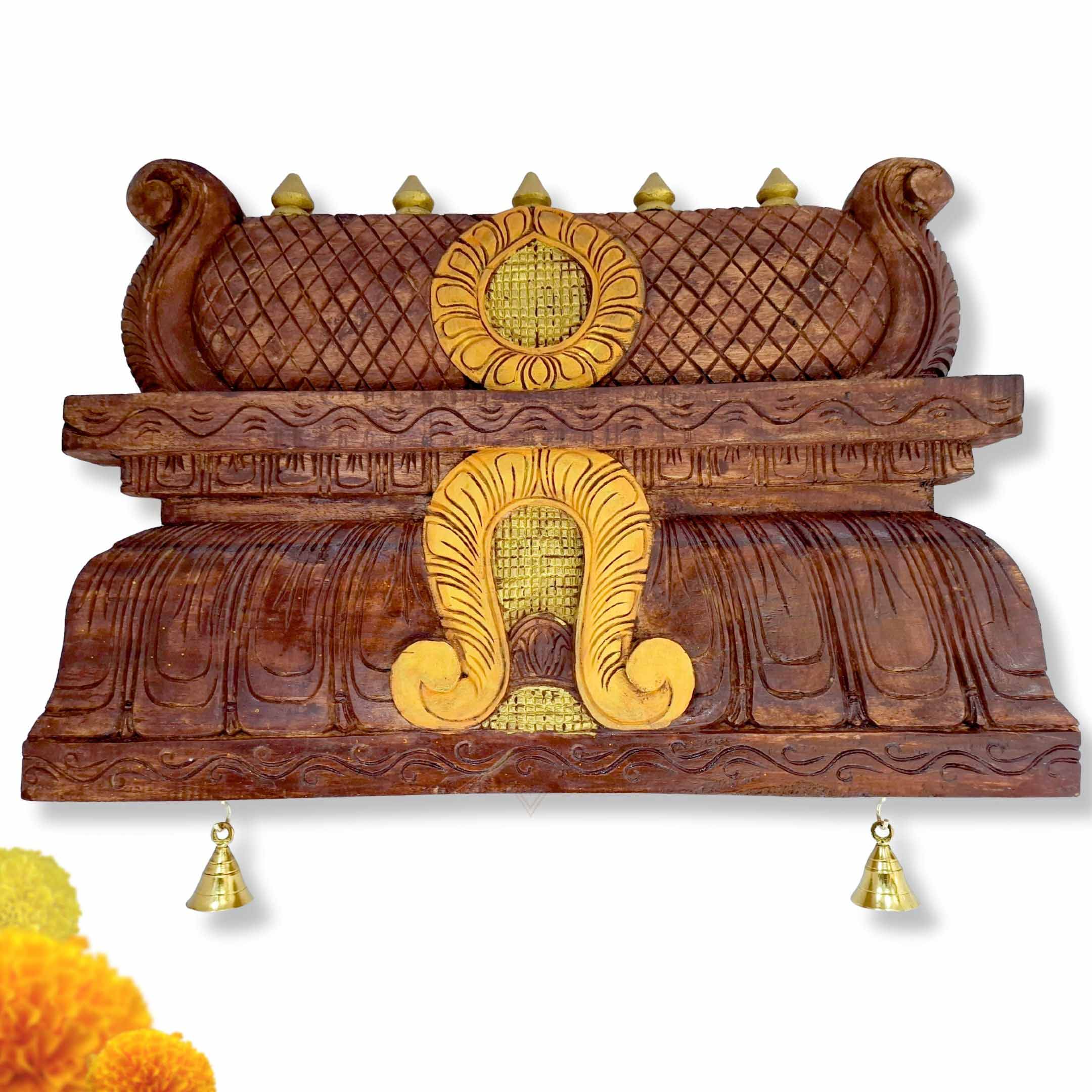 Hand-carved wooden temple gopuram wall panel with brass bells, South Indian mandir dome decor for pooja room.
