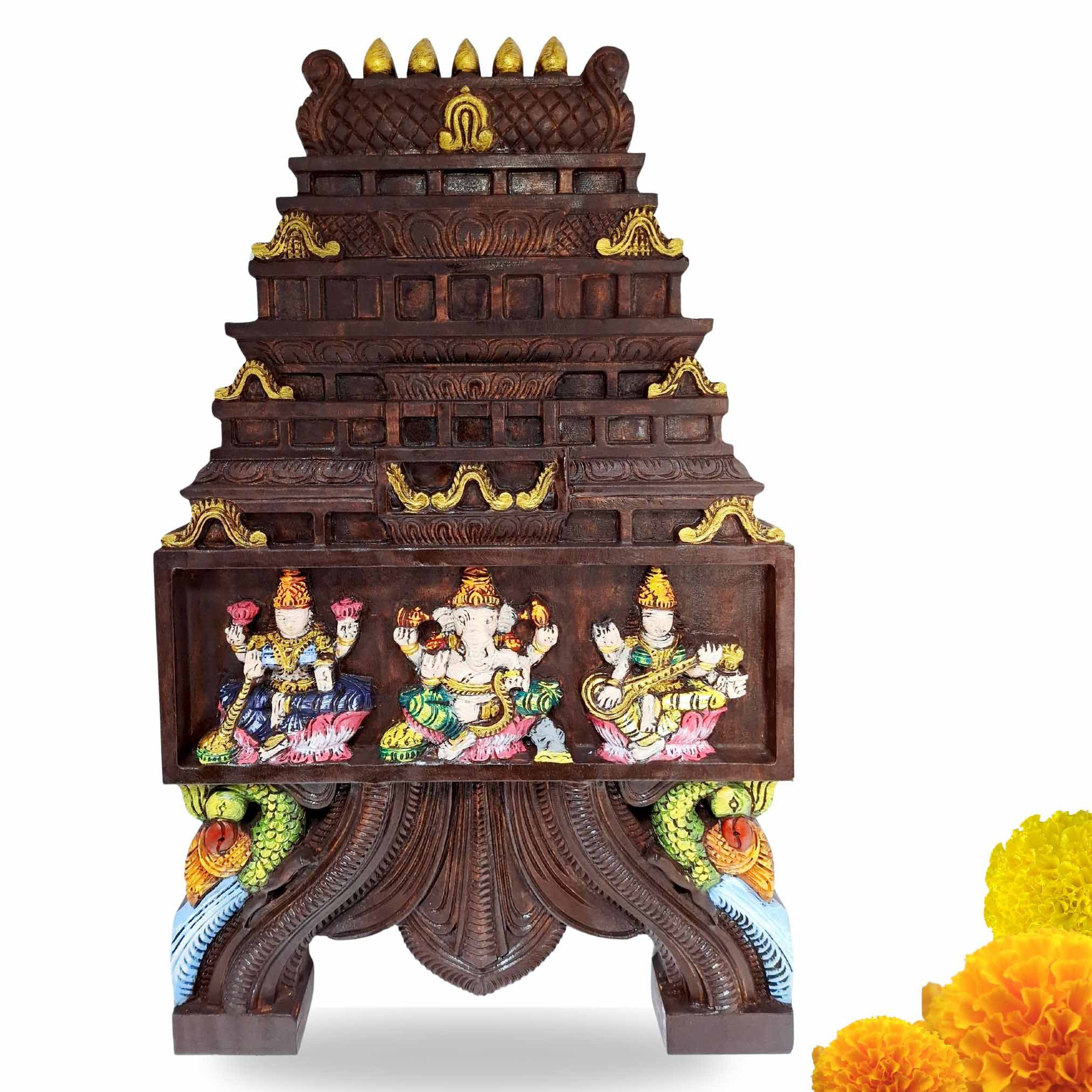 Hand-carved wooden Kavadi wall panel with Lakshmi, Ganesha, and Saraswathi deities in South Indian temple-style design, 24 inches, by JLine Arts