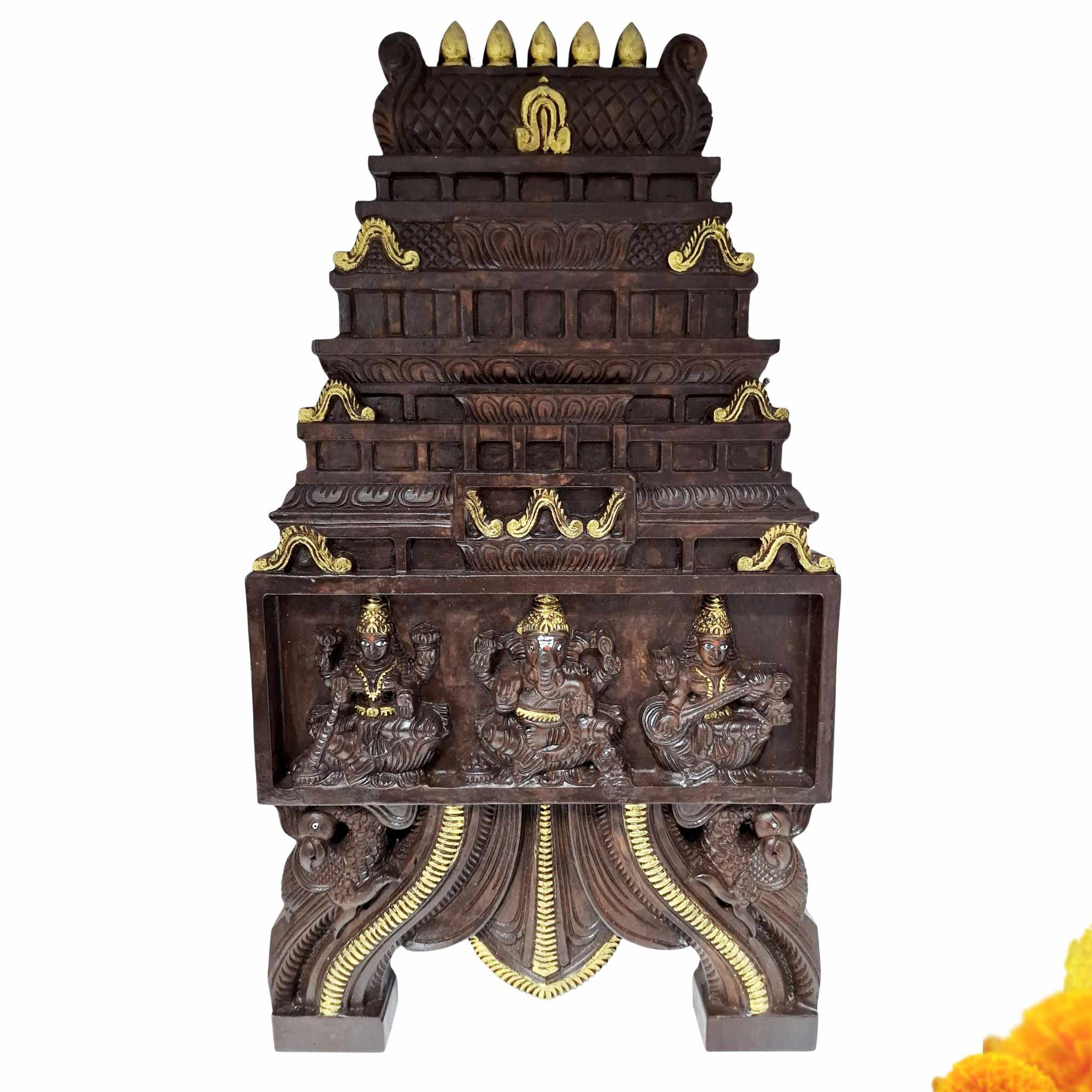 Hand-carved mahogany temple gopuram wall panel with Lakshmi Ganesha Saraswati