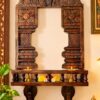Hand-carved wooden pooja mandap with temple gopuram, pillars and wall-mounted shelf in Mahogany wood